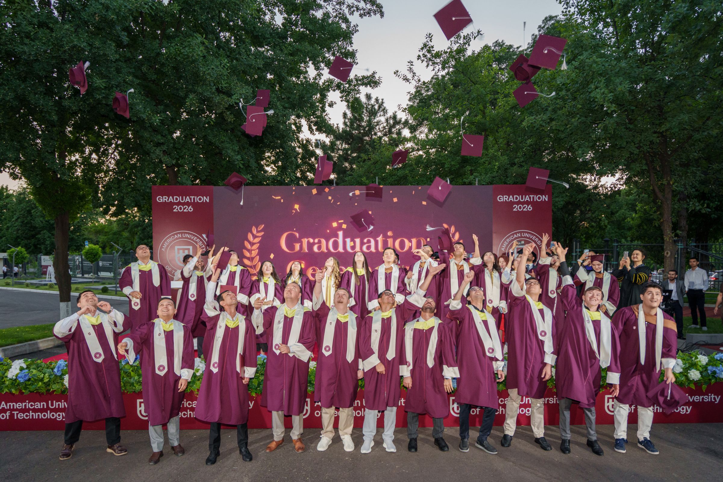 AUT students celebrating at a graduation ceremony
